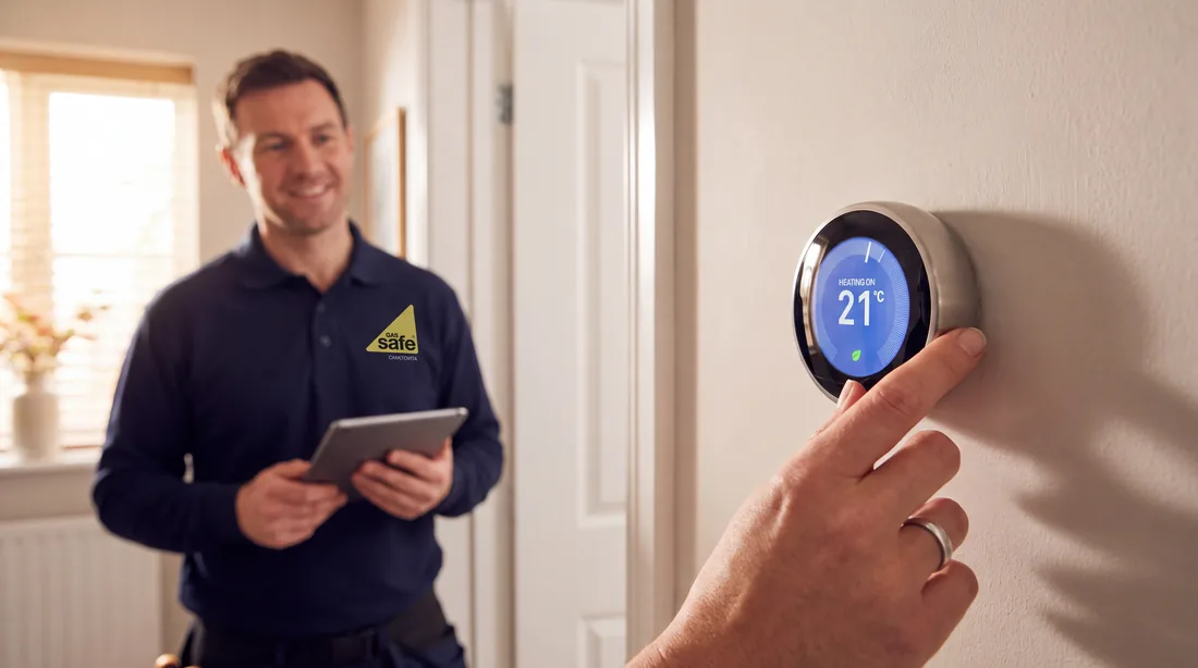 A smart thermostat being set up in a Coventry home